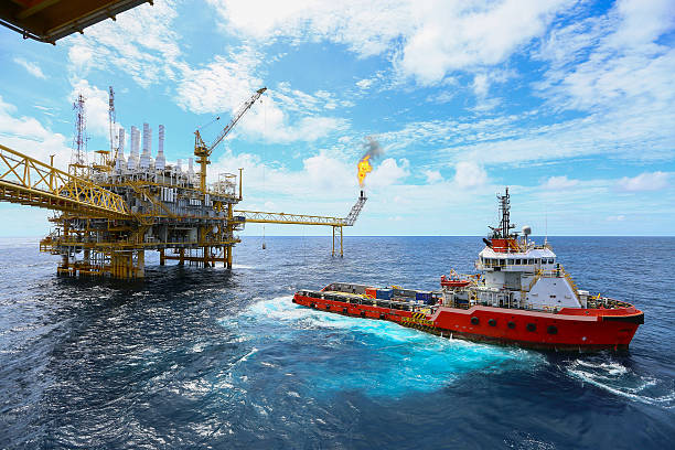 istockphoto-587888618-612x612 Offshore construction platform for production oil and gas, Oil and gas industry and hard work,Production platform and operation process by manual and auto function, oil and rig industry and operation.