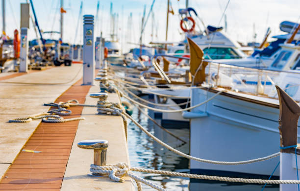 shipyardstuff Sailing boats moored at the pier in Portocolom on Mallorca, Spain Balearic islands
